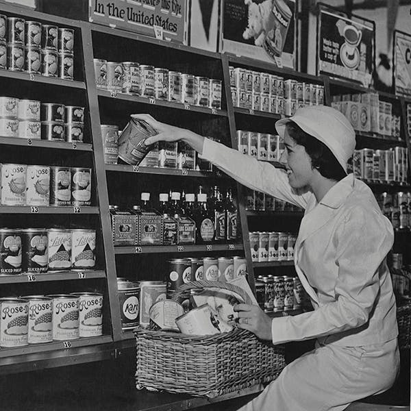 black and white huty 17375 shopping one person sitting side view half length food shelf person human shop grocery store supermarket market