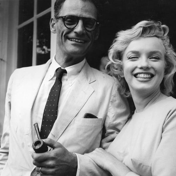 format square;pipe;male;female;couple;film;film actress;the stage;playwright;personality;american;es c 2811;es p/monroe/marilyn tie accessories person human clothing glasses suit coat overcoat shirt