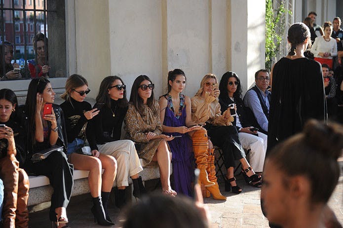 personajes internacionales milan clothing apparel person human sitting footwear crowd sunglasses accessories tie